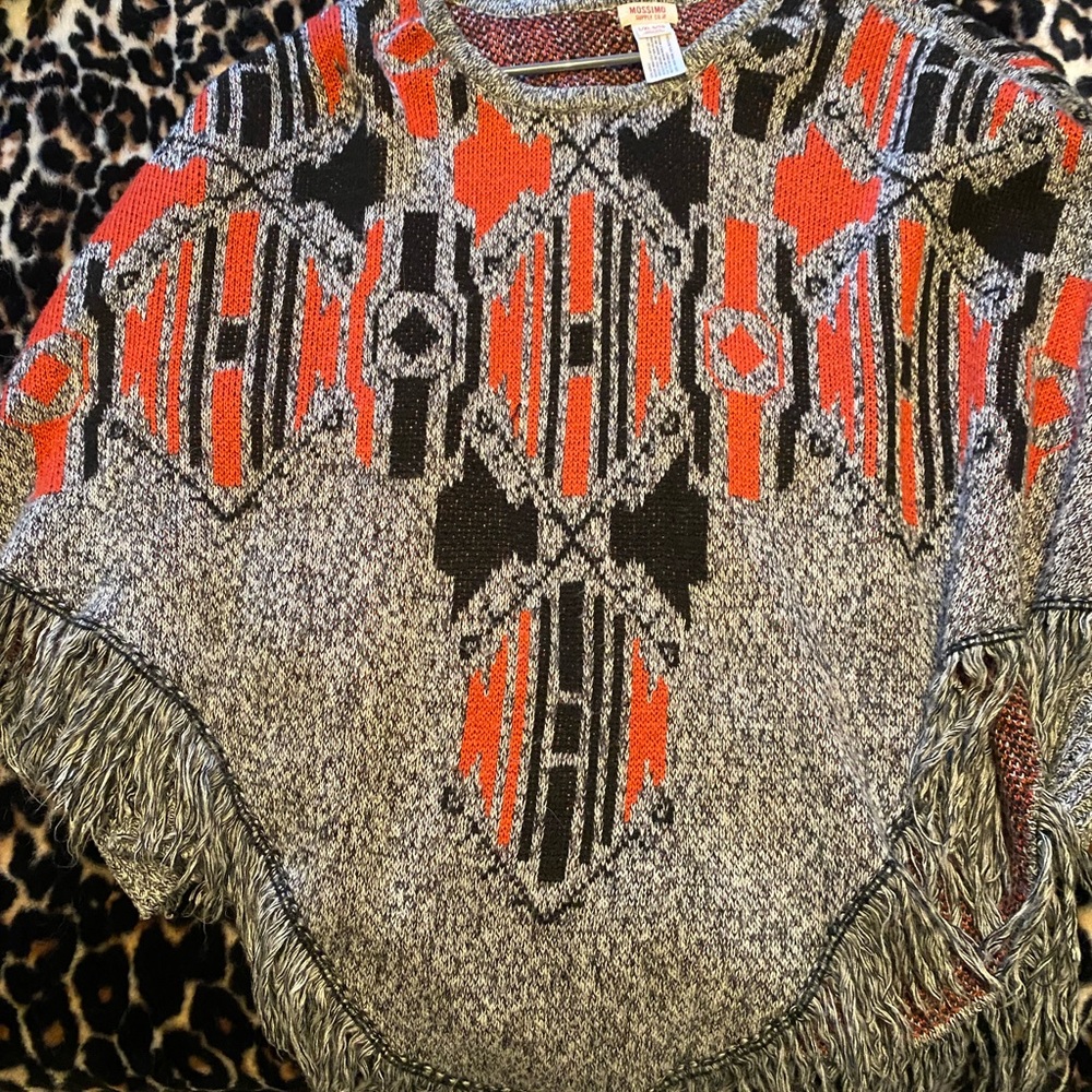 Poncho style sweater with sleeves